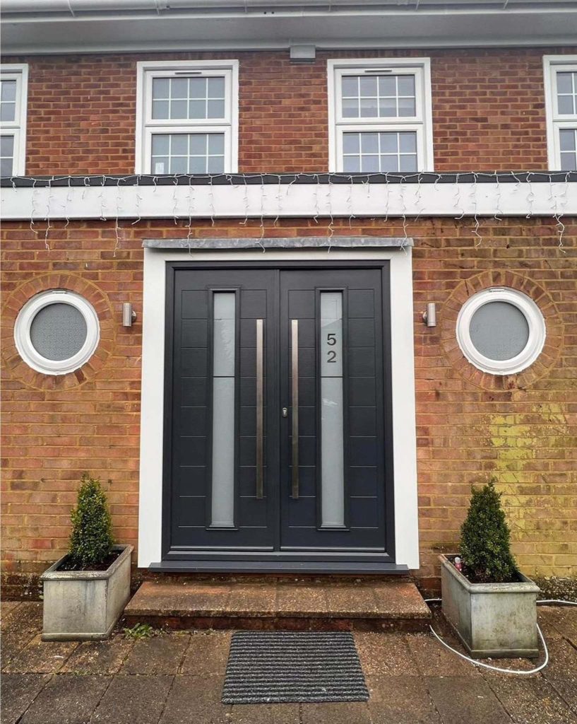 Black double front doors with numbered glass